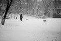 Snowing urban landscape with people Royalty Free Stock Photo