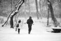 Snowing urban landscape with people