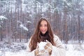 Snowing winter beauty fashion concept. Women in winter clothes. Outdoor close up portrait of young beautiful girl with