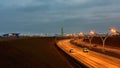 Snowless winter evening. High point view to section of the Western High-Speed Diameter on Vasilievsky Island Royalty Free Stock Photo