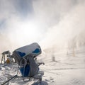 Snowmaking machine snow cannon or gun in action Royalty Free Stock Photo