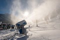 Snowmaking machine snow cannon or gun in action Royalty Free Stock Photo