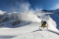 Snowmaking - snow cannon working on the slope Royalty Free Stock Photo