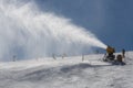 Snowmaking spraying snow Royalty Free Stock Photo