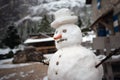 Snowman against Alpine panorama Royalty Free Stock Photo