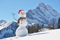 Snowman against Alpine panorama Royalty Free Stock Photo