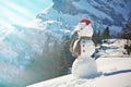 Snowman against Alpine panorama Royalty Free Stock Photo