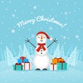Snowman on the background of snow and trees Royalty Free Stock Photo