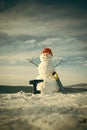 Snowman builder in winter in helmet.