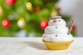 Snowman cookie and christmas tree behind Royalty Free Stock Photo