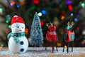 Snowman, Deer Reindeer and Christmas tree. Winter home decorations. Holiday traditions and gifts Royalty Free Stock Photo