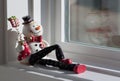 Snowman doll in the window Royalty Free Stock Photo