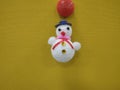 Snowman doll yellow background