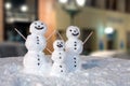 Snowman Family Decorated With Coffee Grains and Wooden Sticks