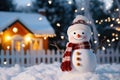 Snowman on a front yard of house decorated with lights and garlands for Christmas eve