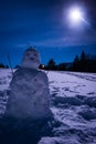 Snowman with a full moon Royalty Free Stock Photo
