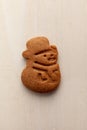 snowman gingerbread cookie isolated on white wooden background Royalty Free Stock Photo