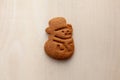 snowman gingerbread cookie on white wooden background Royalty Free Stock Photo