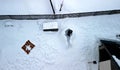 a snowman lying with arms outstretched on his back on a blanket and sunbathing. Royalty Free Stock Photo