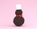 Snowman made of chocolate concept on pastel pink color background. minimal winter and new year concept. Creative for festival