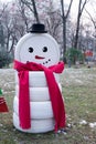 Snowman made by tire car.