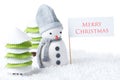 Snowman with Merry Christmas sign Royalty Free Stock Photo