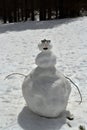 A snowman with mountains behind