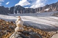 Snowman mountains glacier stones summer