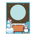 Snowman and penguin with blank wooden sign card Royalty Free Stock Photo