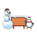 Snowman and penguin with blank wooden sign Royalty Free Stock Photo