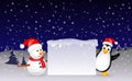 Snowman and penguin Christmas with blank sign Royalty Free Stock Photo