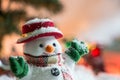 Snowman among pile of snow at silent night with a light bulb, light up the hopefulness and happiness