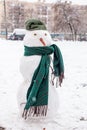 Snowman on playground in Kiev. first snowfall in city. Children& x27;s active games outdoor in Winter Scenery Royalty Free Stock Photo