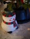 Snowman with red - green hat and scarf. Symbol of Christmas season is coming soon Royalty Free Stock Photo