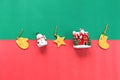 Snowman, santa claus and christmas or new year decoration or ornament on red and green background Royalty Free Stock Photo