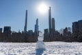 Snowman on the Sheep Meadow at Central Park in New York City during the Winter with the Midtown Manhattan Skyline in the Backgroun Royalty Free Stock Photo