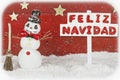 A snowman with a signpost with the words Merry Christmas on spanish