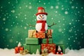 Snowman sitting on top of pile of presents