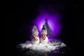 Snowman and Snow Woman with Heart on snow in dark background. New Year and Christmas conceptual image with fir tree. Sweet Snowman Royalty Free Stock Photo