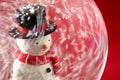 Snowman in Snowglobe with red background Royalty Free Stock Photo