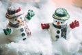 Snowman stand among pile of snow at silent night with a light bulb,Merry christmas and new year night. Royalty Free Stock Photo