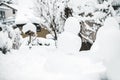 Snowman standing in the garden, snow covered on winter season