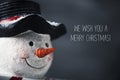 Snowman and text we wish you a merry christmas