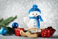 Snowman toy with wooden sleigh Royalty Free Stock Photo