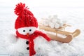 Snowman toy and wooden sleigh Royalty Free Stock Photo