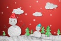 Snowman wearing red Santa hat in winter with snow, paper cut made of crumpled paper, Christmas Background Royalty Free Stock Photo