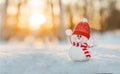 Snowman in winter wonderland scene. Christmas, New Year postcard design. Wintertime magic. Snowman in december snow at sunset Royalty Free Stock Photo