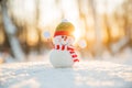 Snowman in winter wonderland scene. Christmas, New Year postcard design. Wintertime magic. Snowman in december snow at sunset Royalty Free Stock Photo