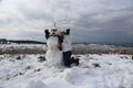 Snowman and young girl