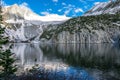 Snowmass Lake in Jun with Snow still on top of the Basin with a large reflection over the lake